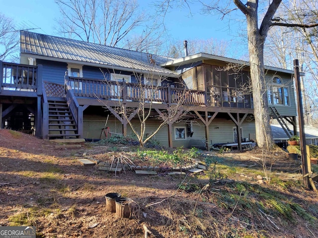 rear view of house featuring a deck