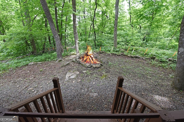 view of yard with an outdoor fire pit