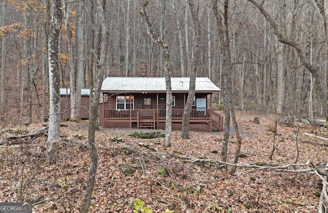 view of front of property with a wooden deck