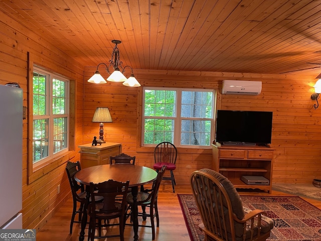 dining area featuring wooden walls, hardwood / wood-style floors, wood ceiling, and a wall mounted air conditioner