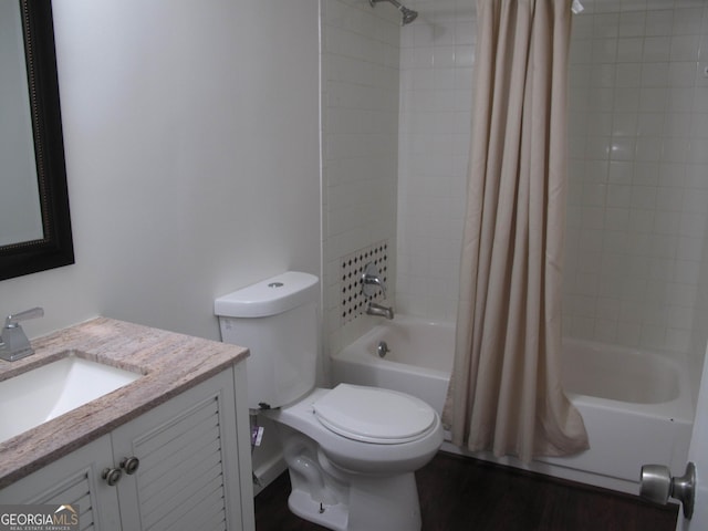 full bathroom with shower / bath combination with curtain, toilet, and vanity