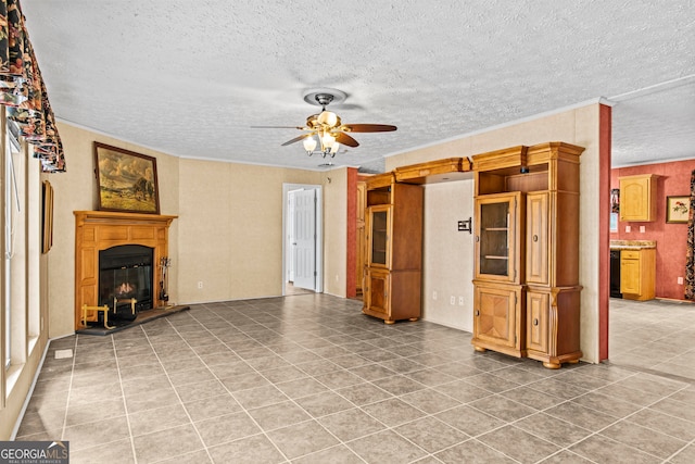 tiled living room with a textured ceiling and ceiling fan