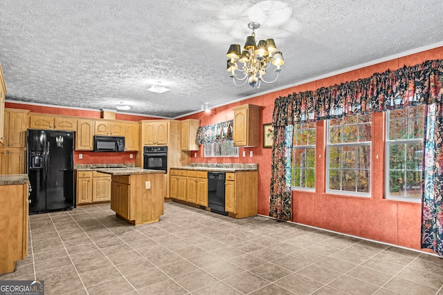 kitchen with a center island, ornamental molding, black appliances, a notable chandelier, and light tile floors