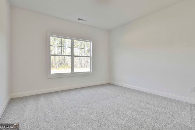 unfurnished room with carpet flooring