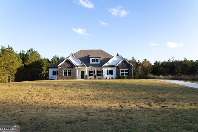 craftsman-style home with a front lawn