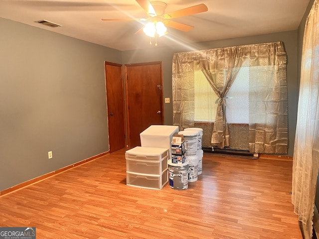 sitting room featuring ceiling fan and light hardwood / wood-style floors