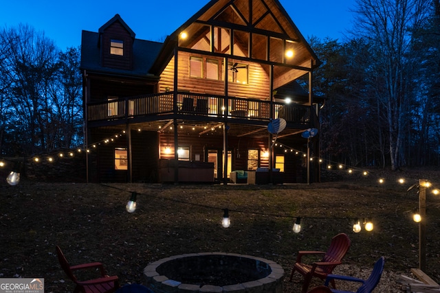 back house at twilight with a fire pit