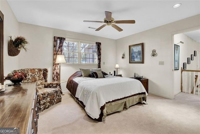 bedroom with light carpet and ceiling fan