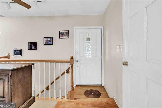 foyer featuring light wood-type flooring and ceiling fan