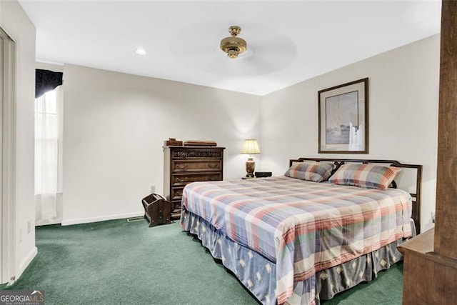 bedroom featuring dark carpet and ceiling fan