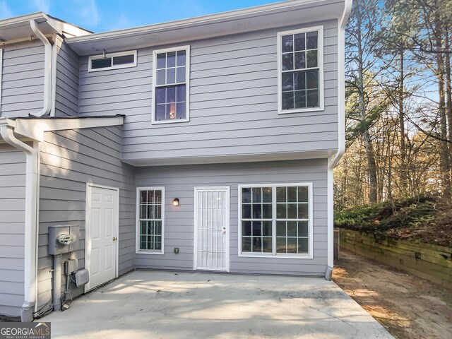 back of property featuring a patio area