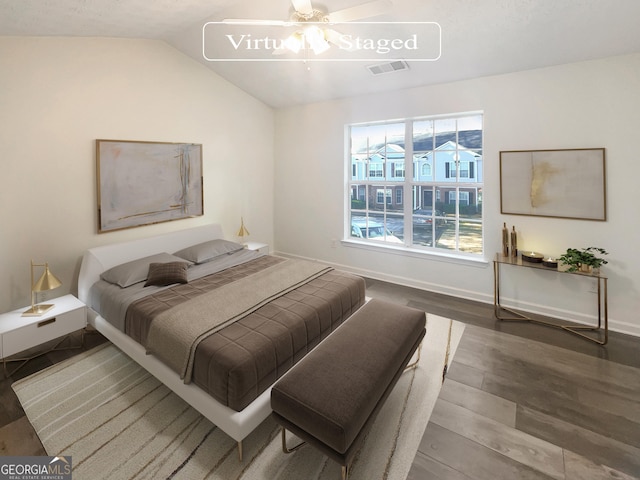 bedroom featuring hardwood / wood-style flooring, ceiling fan, and lofted ceiling