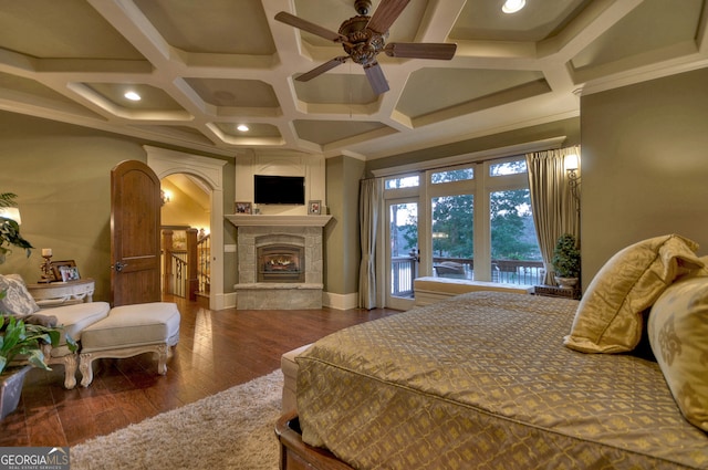 bedroom with coffered ceiling, hardwood / wood-style floors, ornamental molding, ceiling fan, and beam ceiling