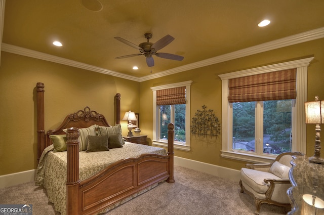 bedroom featuring ornamental molding, ceiling fan, and carpet floors