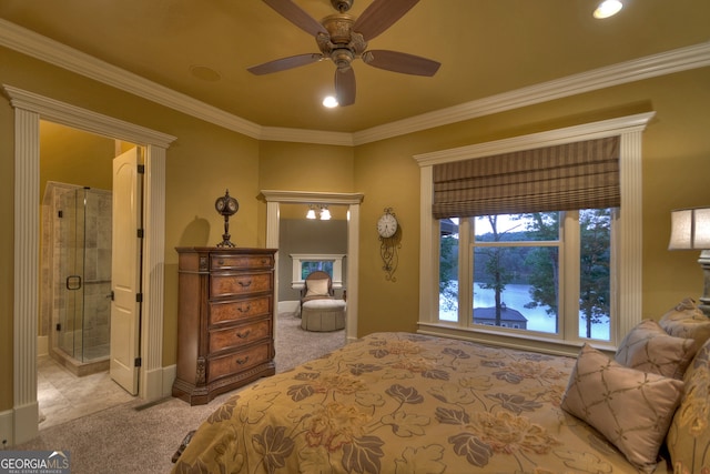 carpeted bedroom with ceiling fan, ornamental molding, and ensuite bathroom