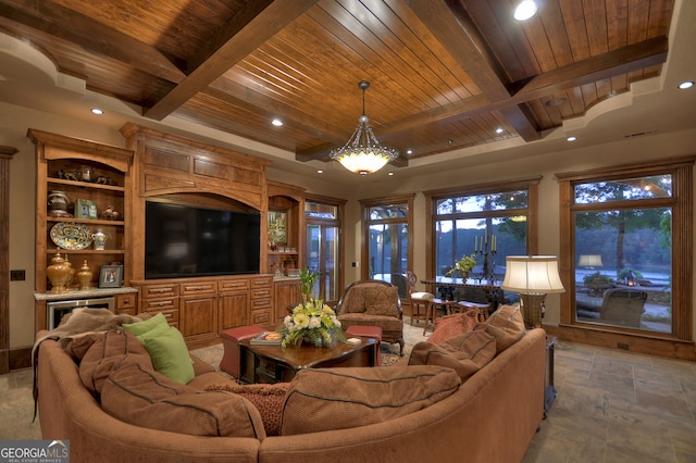 living room featuring an inviting chandelier, beamed ceiling, and wooden ceiling