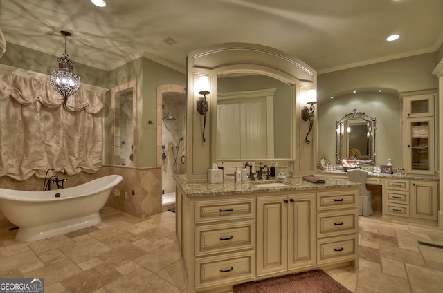 bathroom with separate shower and tub, ornamental molding, an inviting chandelier, and vanity