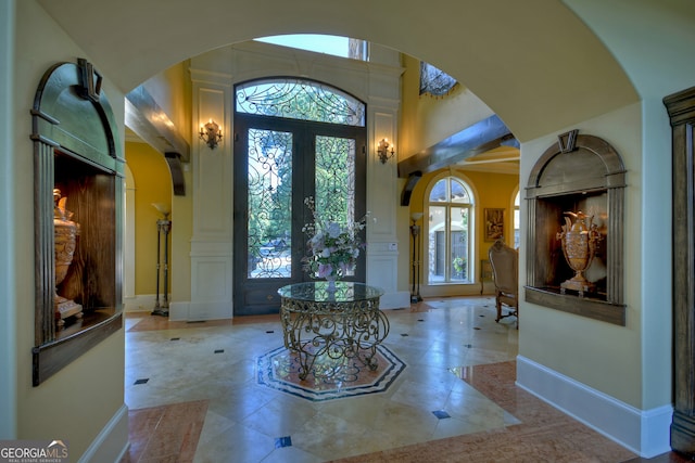 tiled entrance foyer with french doors