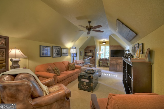 carpeted living room with a textured ceiling, ceiling fan, and vaulted ceiling