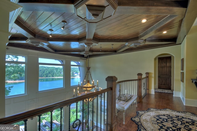 hallway featuring wood ceiling, a notable chandelier, wood-type flooring, and a water view