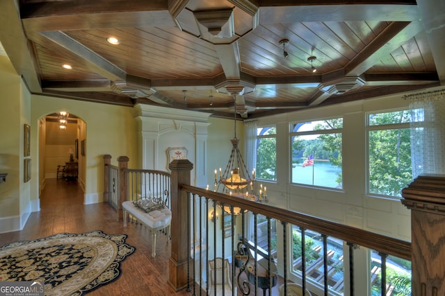 hall with wooden ceiling, wood-type flooring, and a notable chandelier