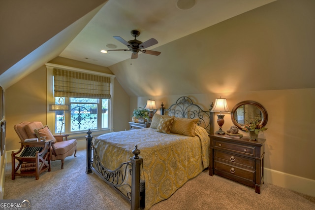 carpeted bedroom with lofted ceiling and ceiling fan