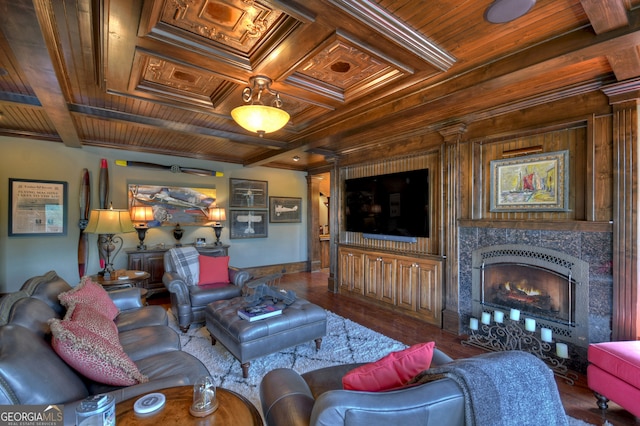 living room featuring a fireplace, beamed ceiling, coffered ceiling, dark hardwood / wood-style flooring, and wooden ceiling