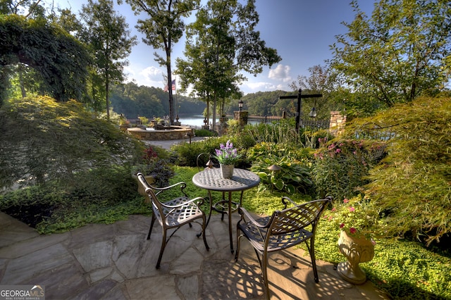 view of patio / terrace with a water view