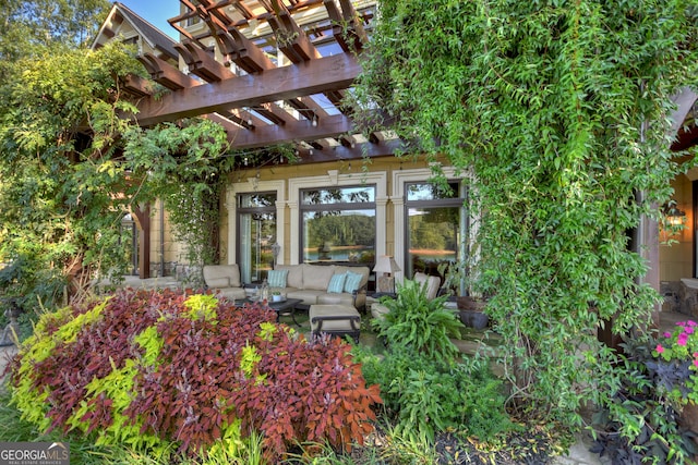 exterior space featuring a pergola and an outdoor hangout area