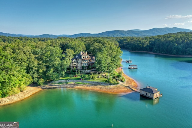 aerial view featuring a water and mountain view