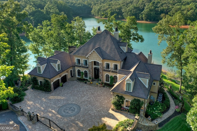 birds eye view of property featuring a water view