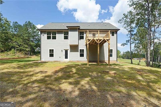 rear view of house with a lawn