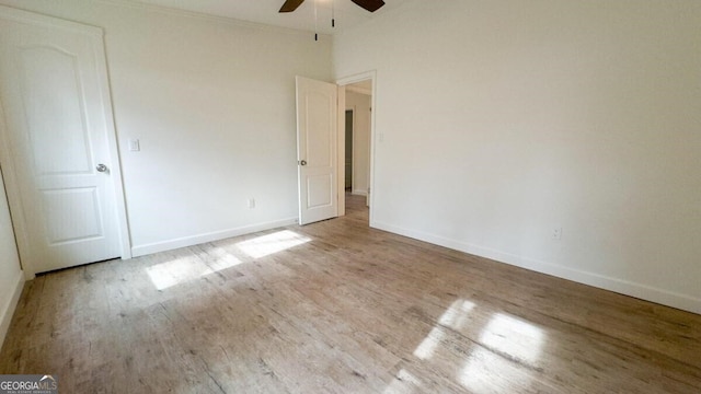 spare room featuring light hardwood / wood-style floors and ceiling fan