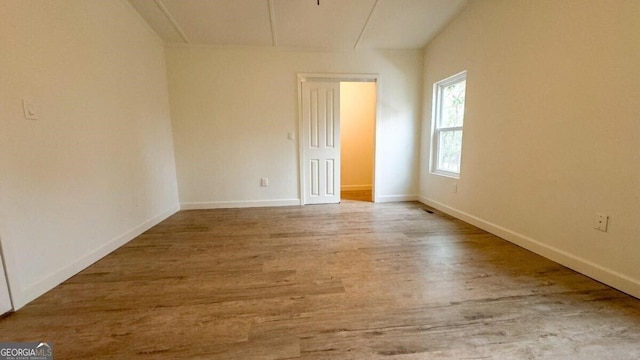 empty room with light hardwood / wood-style floors