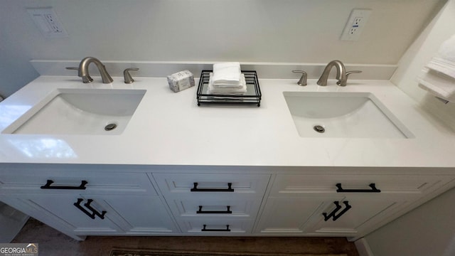 bathroom featuring dual bowl vanity