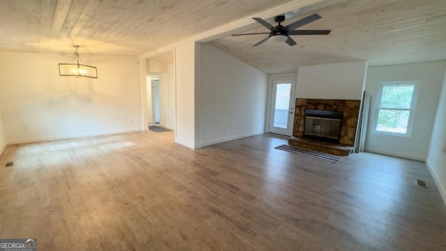 unfurnished living room featuring wooden ceiling, a fireplace, light hardwood / wood-style flooring, and ceiling fan with notable chandelier