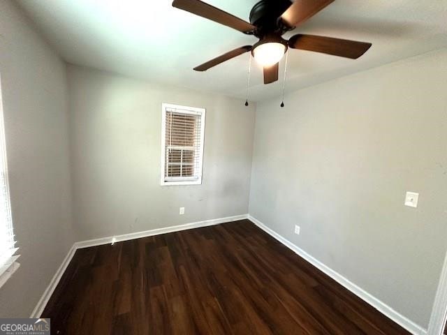 empty room featuring dark wood-type flooring