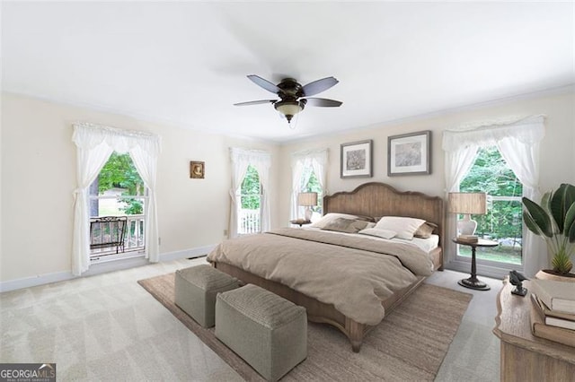 bedroom with ceiling fan, light colored carpet, and access to outside