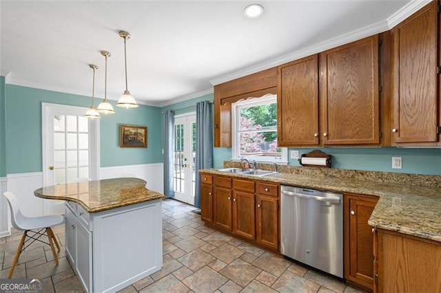 kitchen featuring french doors, light stone counters, stainless steel dishwasher, sink, and hanging light fixtures