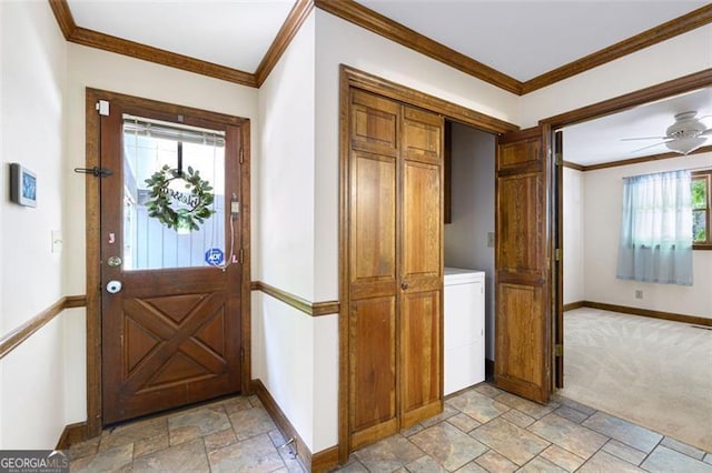 entrance foyer featuring a healthy amount of sunlight, washer / dryer, and crown molding