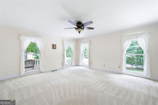 empty room with light carpet and ceiling fan