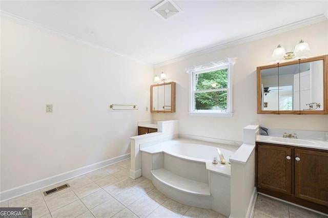 bathroom with a bathing tub, vanity, crown molding, and tile patterned flooring