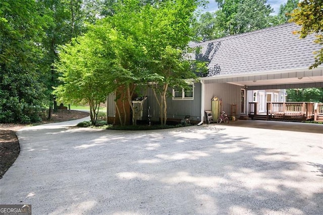 back of house with a deck