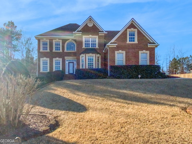 view of front of property with a front lawn