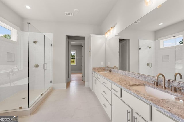 170 Ewing Way, Dacula, GA 30019 - full bath featuring plenty of natural light, double vanity, a stall shower, and recessed lighting