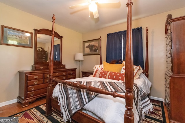 bedroom featuring ceiling fan and dark hardwood / wood-style floors