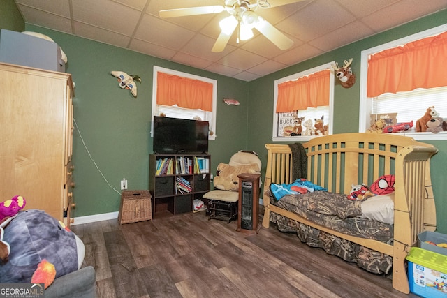 bedroom featuring ceiling fan and dark hardwood / wood-style flooring