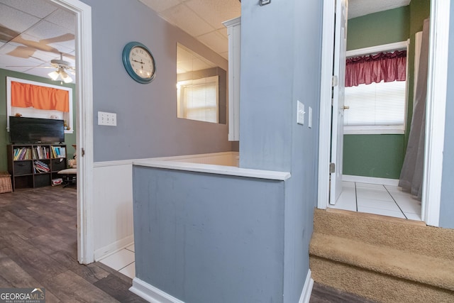 corridor with wood-type flooring