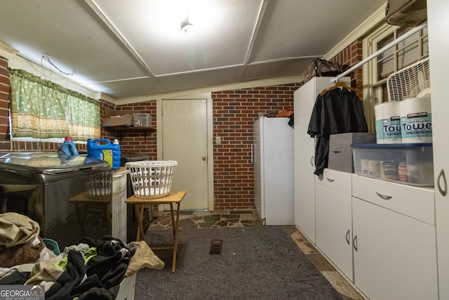 interior space featuring brick wall