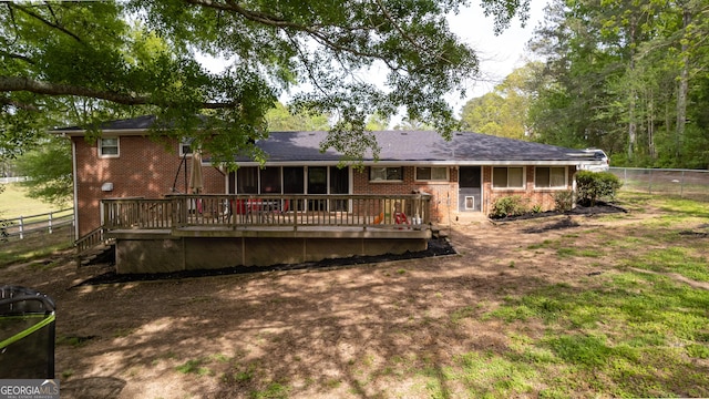 rear view of house featuring a deck